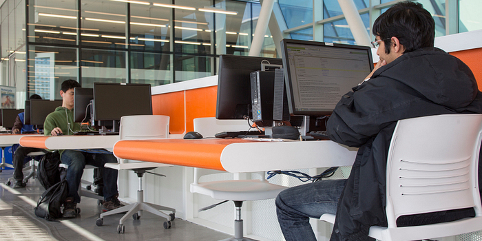 Centennial College student at the Ashtonbee Library printing.